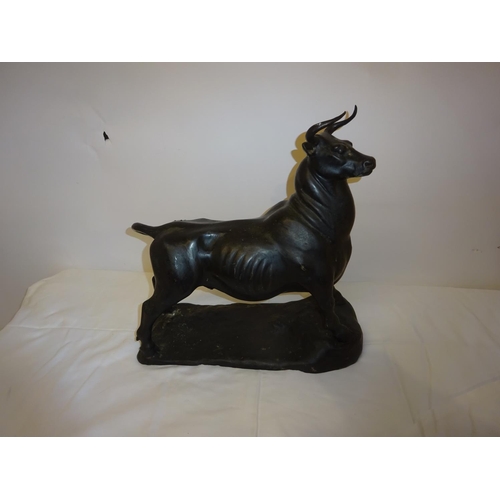 106 - Bronze bull sculpture. L. 34cm, H. 34cm, W. 14cm.