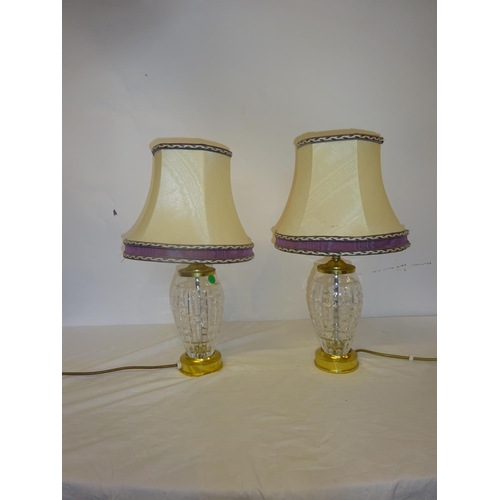 107 - A pair of glass vase lamps and shades.