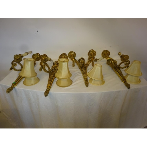 110 - A good set of four heavy cast brass two branch wall lights with fabric shades. Overall height 54cm a... 