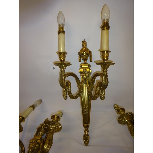 110 - A good set of four heavy cast brass two branch wall lights with fabric shades. Overall height 54cm a... 