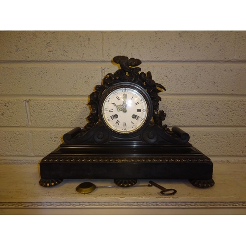 117 - A good antique French marble mantle clock, the 12cm circular dial surmounted with bronze flowers and... 