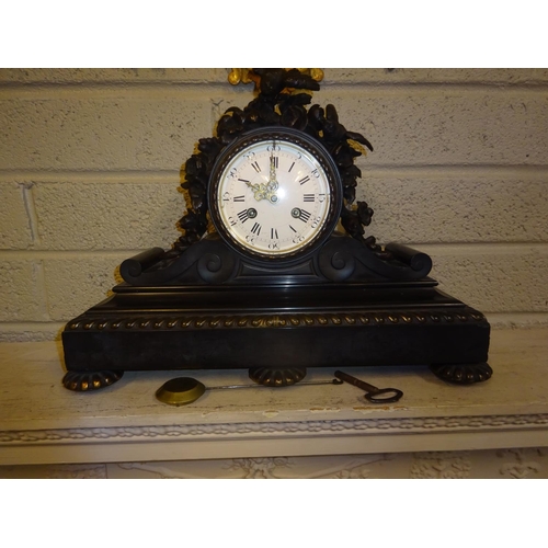 117 - A good antique French marble mantle clock, the 12cm circular dial surmounted with bronze flowers and... 