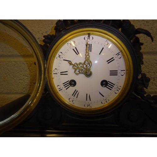 117 - A good antique French marble mantle clock, the 12cm circular dial surmounted with bronze flowers and... 