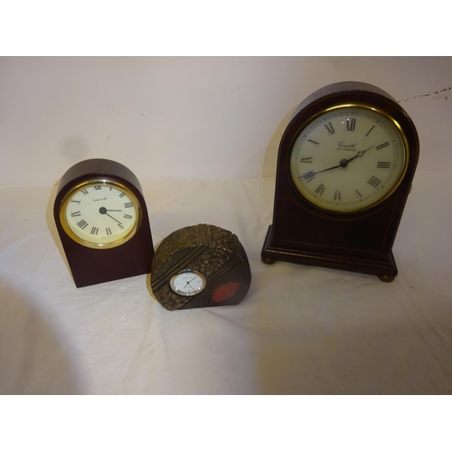 13 - Three modern mantel clocks.