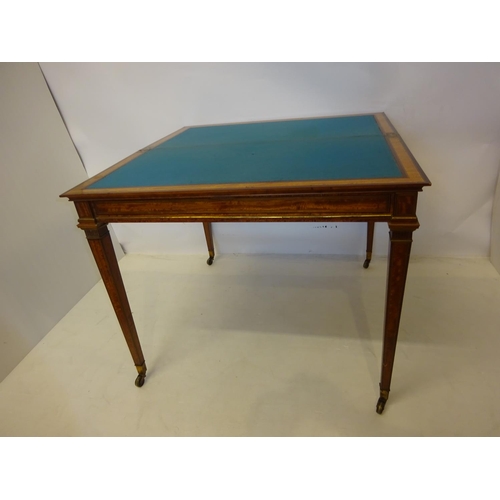 130 - Good antique satinwood writing/card table, the rectangular shaped folding top with leather inset rai... 