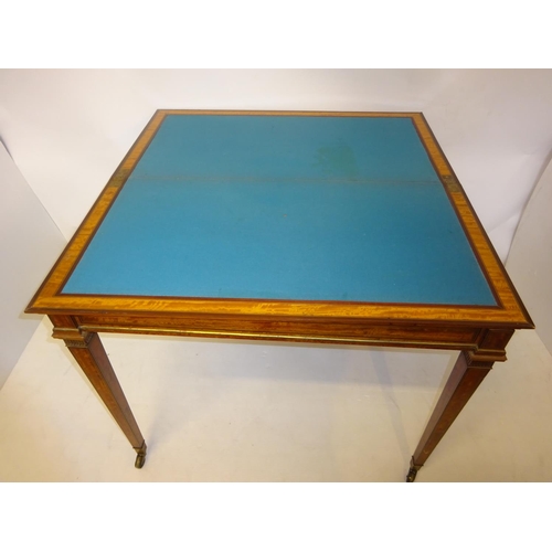 130 - Good antique satinwood writing/card table, the rectangular shaped folding top with leather inset rai... 