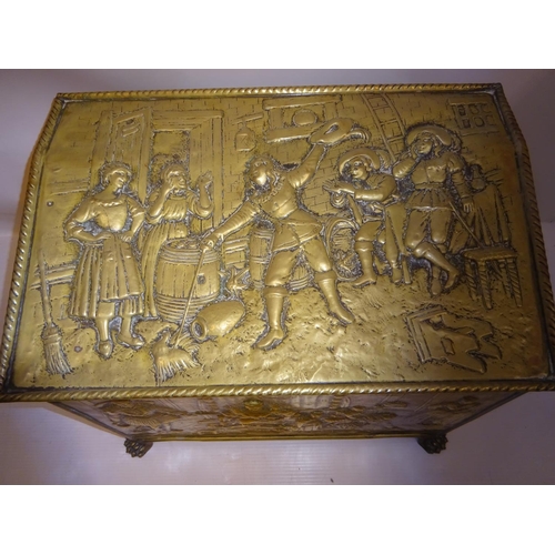 141 - Good old brass coal box with raised figure decoration, complete with liner. W. 57cm.