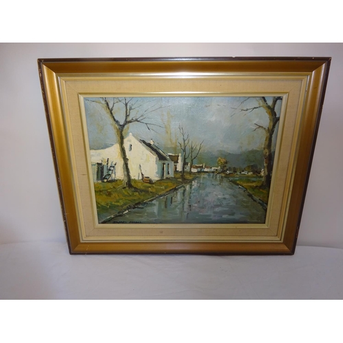 149 - Donald James Madge 1920-1997,
Cottages by river,
Oil on board,
Signed lower left,
35cm x 45cm.