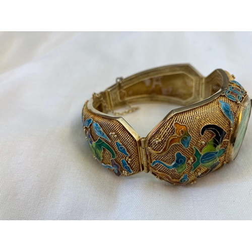 160 - Vintage Asian bracelet, silver with gold finish having enamel decoration and a large jade stone.