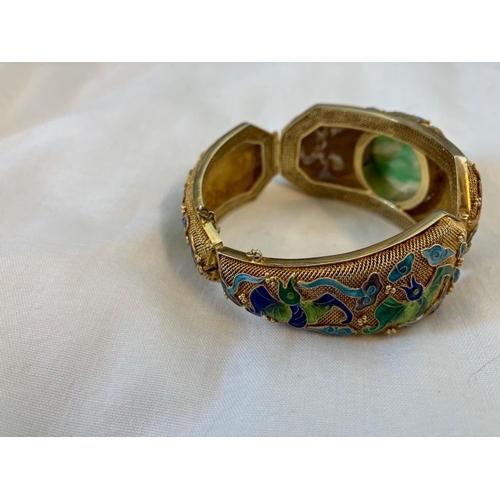 160 - Vintage Asian bracelet, silver with gold finish having enamel decoration and a large jade stone.