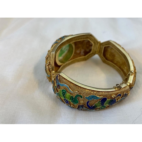 160 - Vintage Asian bracelet, silver with gold finish having enamel decoration and a large jade stone.