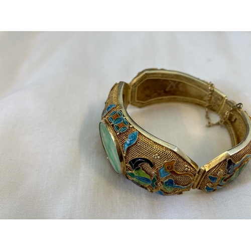 160 - Vintage Asian bracelet, silver with gold finish having enamel decoration and a large jade stone.