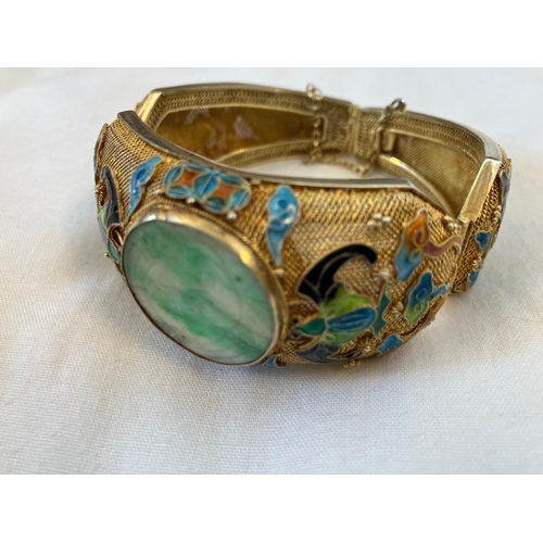 160 - Vintage Asian bracelet, silver with gold finish having enamel decoration and a large jade stone.