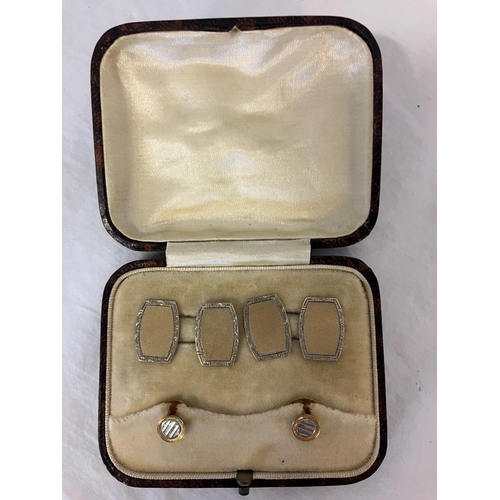 168 - A pair of old 9ct gold cuff links and shirt studs in original box.