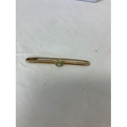 170 - 15ct gold bar brooch with colour stone.