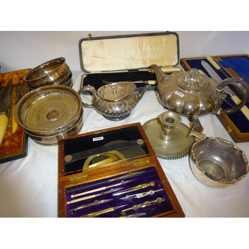 177 - A lot of plated ware - wine coasters, teapots, carving sets together with a cased compass set and a ... 