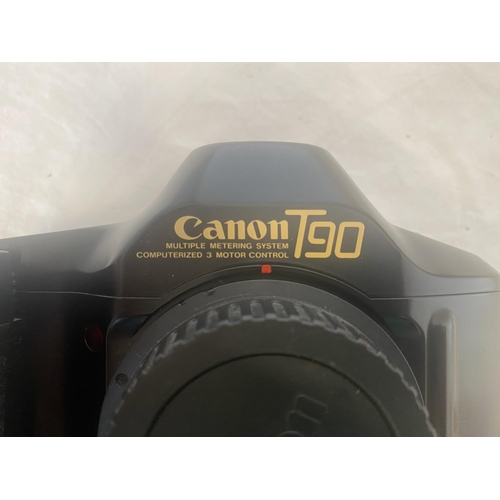 200 - Canon T-90. See photos.