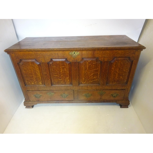 209 - A good early antique oak coffer having lift up top, panelled front over two drawers raised on bracke... 