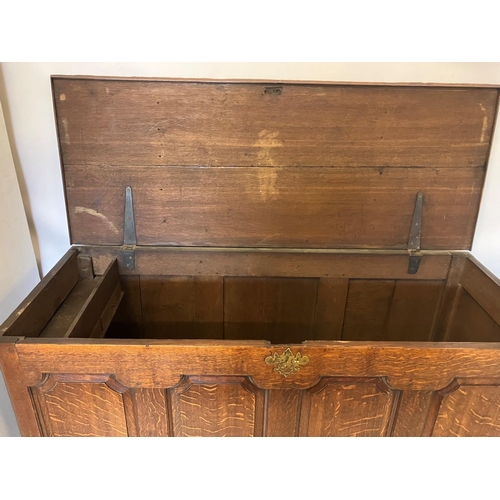 209 - A good early antique oak coffer having lift up top, panelled front over two drawers raised on bracke... 