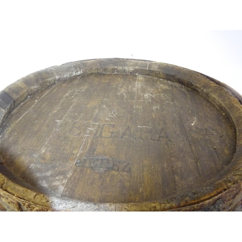 221 - A large old oak sherry barrel. H. 130cm. Diameter at top 70cm.