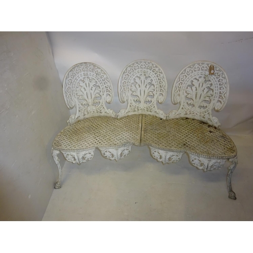 222 - A cast aluminium garden seat. W. 135cm, H. 86cm