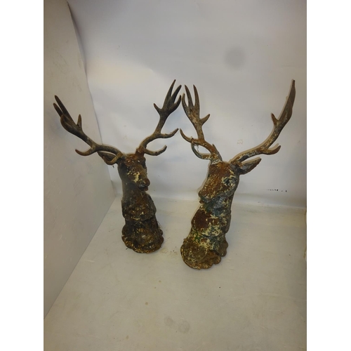 223 - A pair of heavy cast iron gate pillar deer heads. Overall height 83cm.