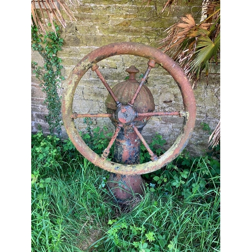 228 - A rare antique cast iron village pump. Diameter of wheel 95cm, overall height 140cm.