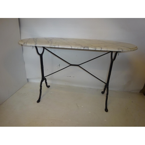 230 - Oval shaped marble top table on metal base. 123cm x 60cm, H. 70cm.