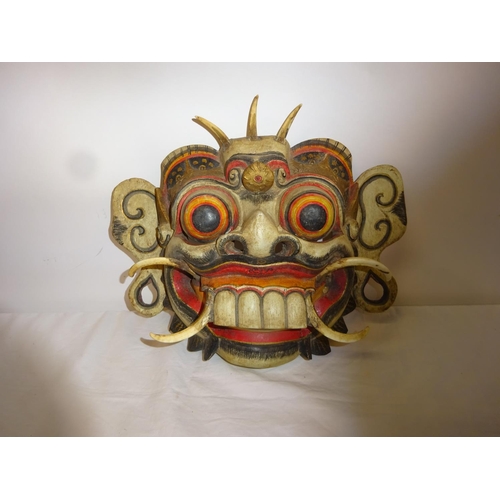 240 - Indonesian carved wood and painted mask.