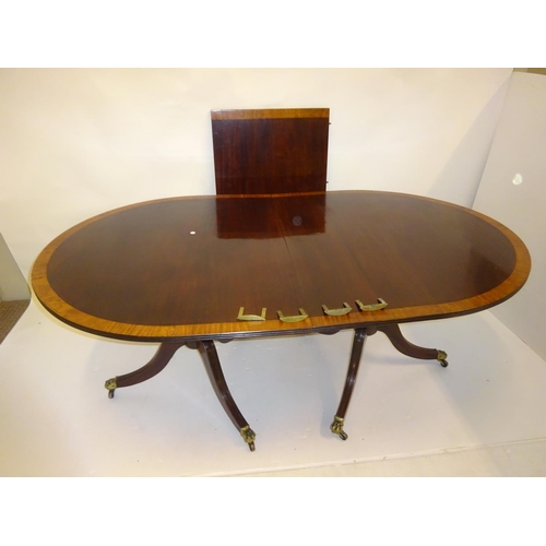 255 - Mahogany two pod dining table with crossbanded top and spare leaf. L. (without leaf) 176cm, W. 107cm... 