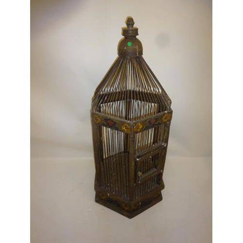 265 - Tall timber bird cage with painted decoration. H. 115cm approx.