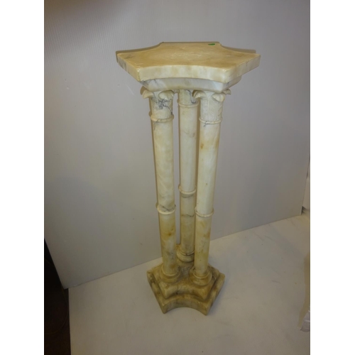 27 - A modern Italian marble pedestal. H. 90cm.