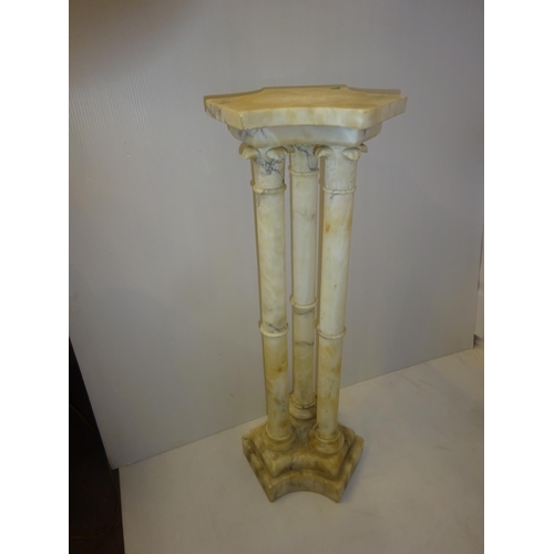 27 - A modern Italian marble pedestal. H. 90cm.