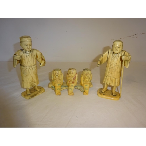 271 - Pair of Chinese figures and three Chinese monkeys on bench. (3)