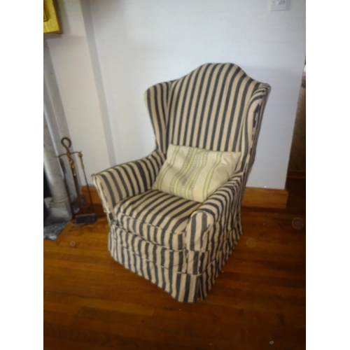 274 - Wing back armchair with striped upholstery loose cover.