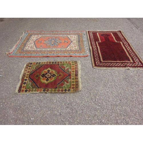 294 - Three various rugs.