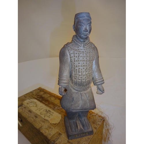 31 - Chinese pottery figure of a warrior with original box. H. of figure 18cm.