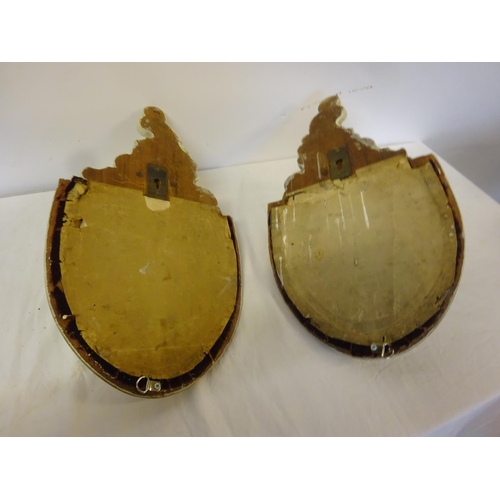 311 - A pair of antique porcelain gothic shaped wall bracket mirrors. H. 50cm, diameter 28cm.