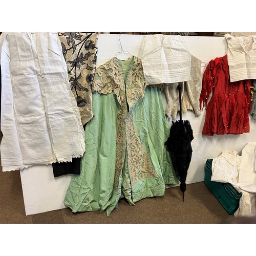 336 - A collection of old christening gowns, costume outfits, etc.