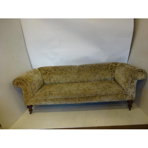 338 - Victorian Chesterfield couch raised on turned legs. L. 220cm approx.