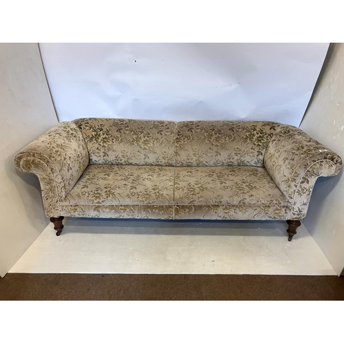 338 - Victorian Chesterfield couch raised on turned legs. L. 220cm approx.