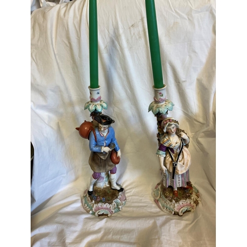 340 - A pair of antique continental porcelain candlestick figures. H. 36cm.