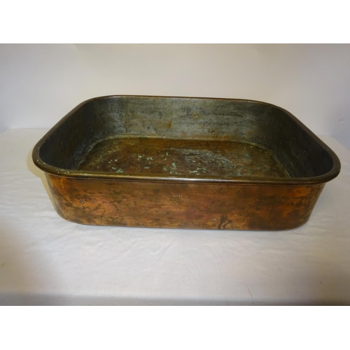 40 - A heavy copper two handled pan by Colley, Dublin. 48cm x 37cm approx.