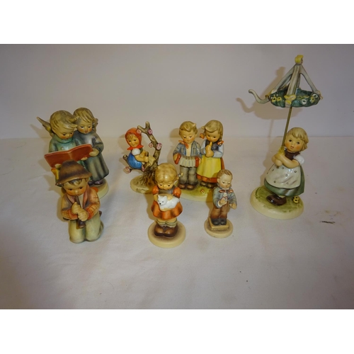 41 - A collection of hummel - 7 figures and 1 small plaque.