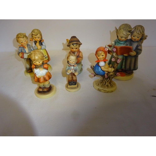 41 - A collection of hummel - 7 figures and 1 small plaque.