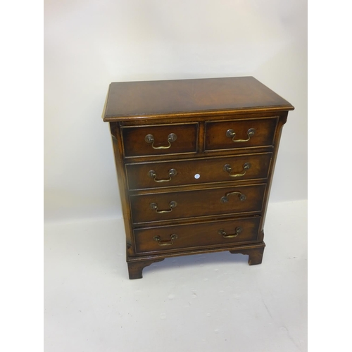 45 - Neat sized mahogany chest of two short and three long drawers with brass drop handles and bracket fe... 