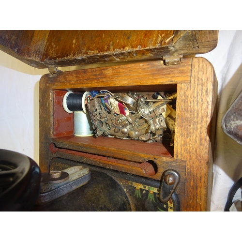 5 - Old singer sewing machine with accessories.