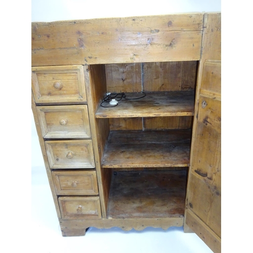 53 - Interesting antique pine press, the front fitted with 5 drawers, large cupboard door with shelf inte... 