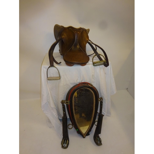 54 - Leather saddle and a harness mirror.