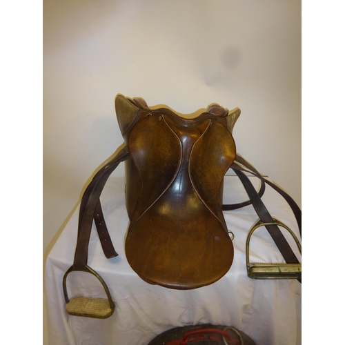 54 - Leather saddle and a harness mirror.